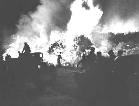 FC-Deep Creek Fire - tank truck holding main fire front along motor way. a (night shot) San Bernardino NF, FC-S,  California, taken by Fred Funke, 1940.